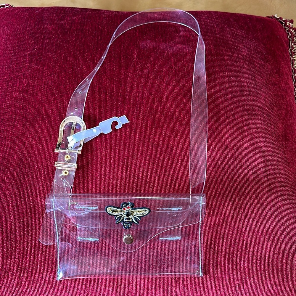 Fanny pack in new condition.  Super cute, clear with a nice gold toned buckle.